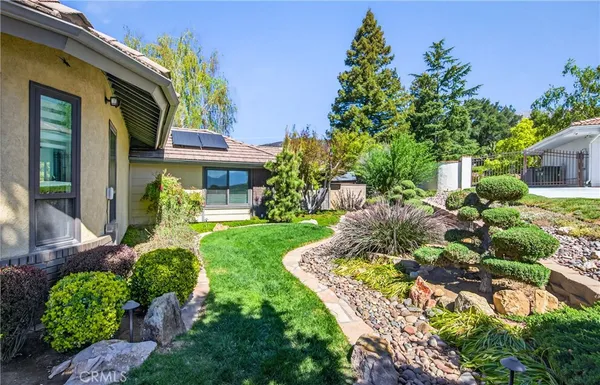 a backyard of a house with lots of green space