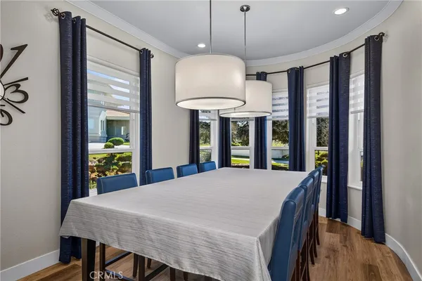 a large kitchen with a table and chairs