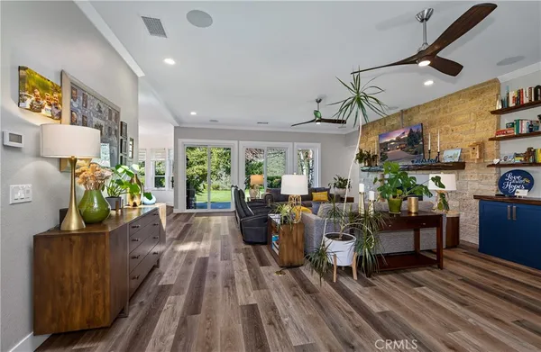 a view of a dining room with furniture window and wooden floor