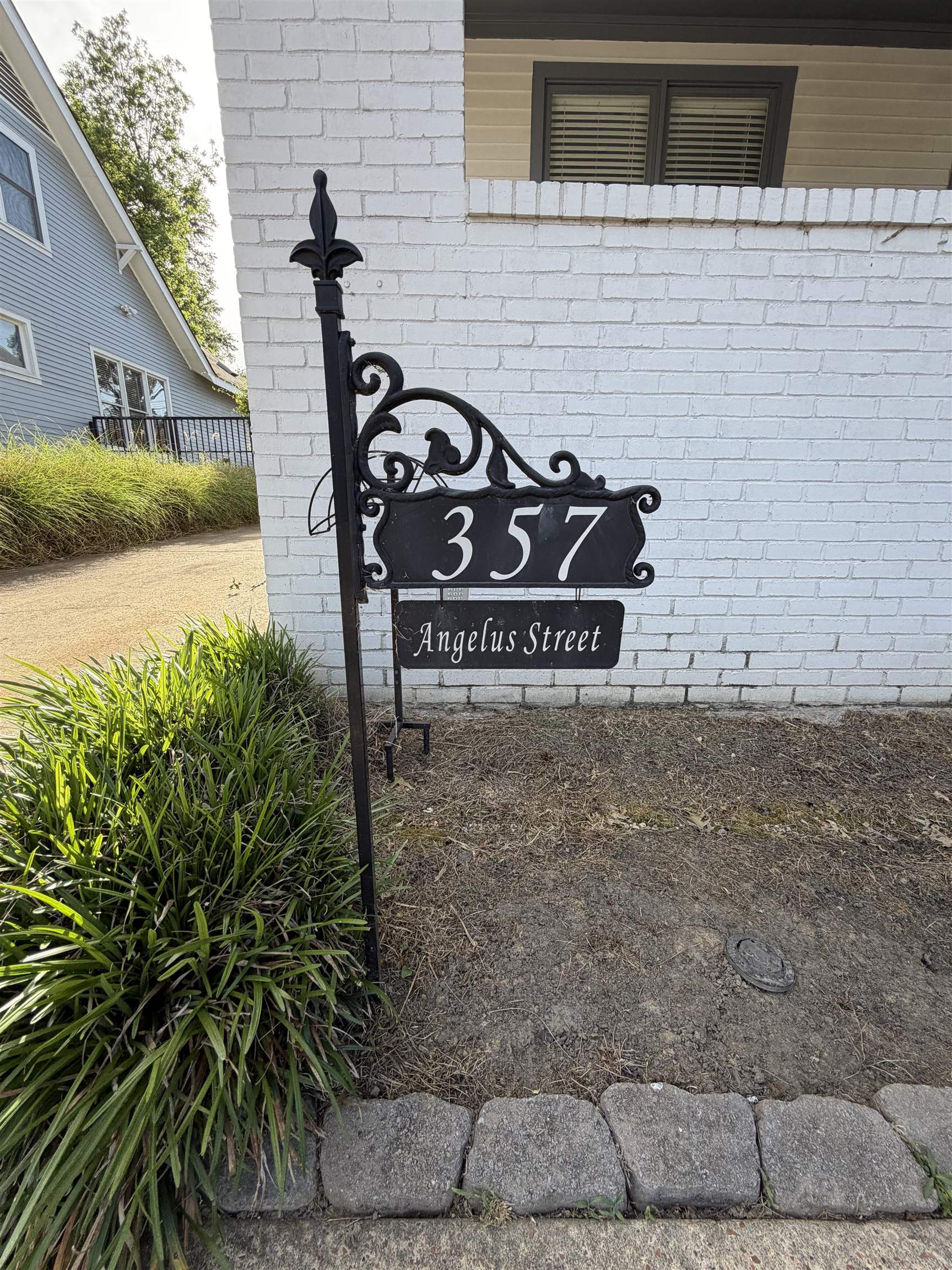 357 Angelus Street Memphis, TN 38112 - Photo 4 of 40 Ornate wrought iron address sign featuring prominent house numbers and street name