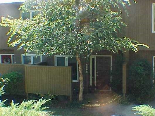 a view of a house with a tree
