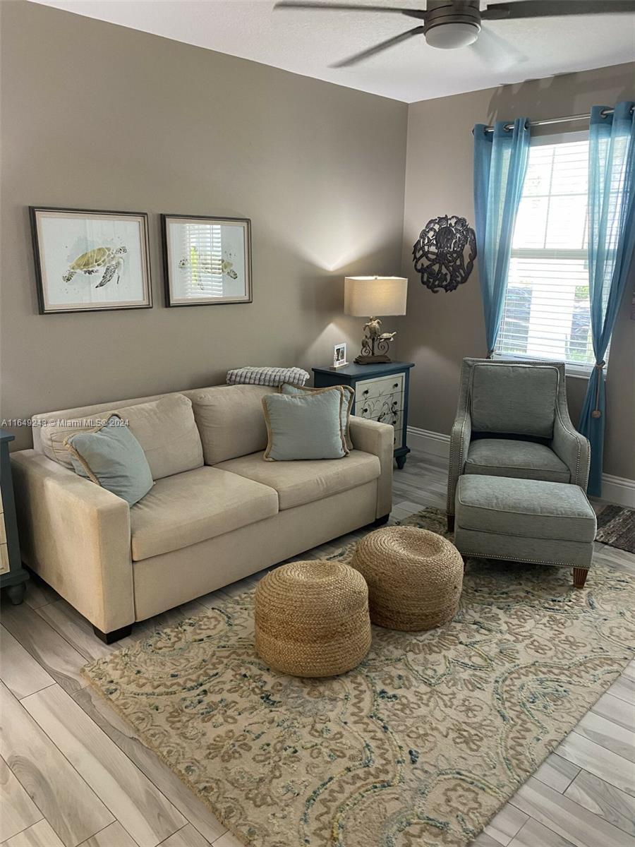 155 Soriano Drive, Unit 155 Jupiter, FL 33458 - Photo 12 of 29 a living room with furniture and a window