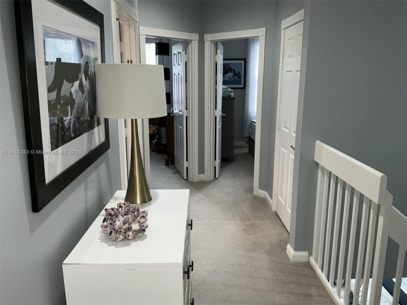 155 Soriano Drive, Unit 155 Jupiter, FL 33458 - Photo 13 of 29 a view of a kitchen from the hallway
