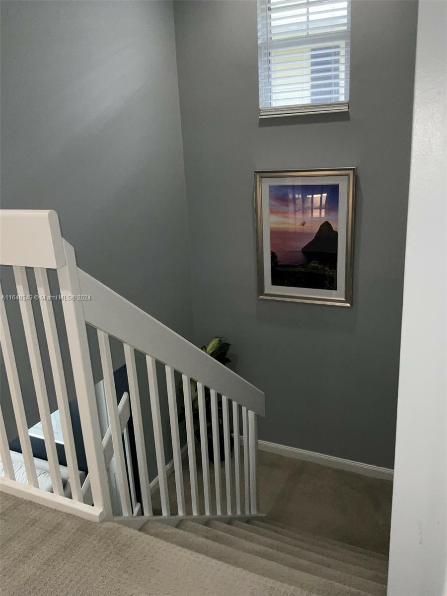 155 Soriano Drive, Unit 155 Jupiter, FL 33458 - Photo 14 of 29 a view of a door and wooden floor
