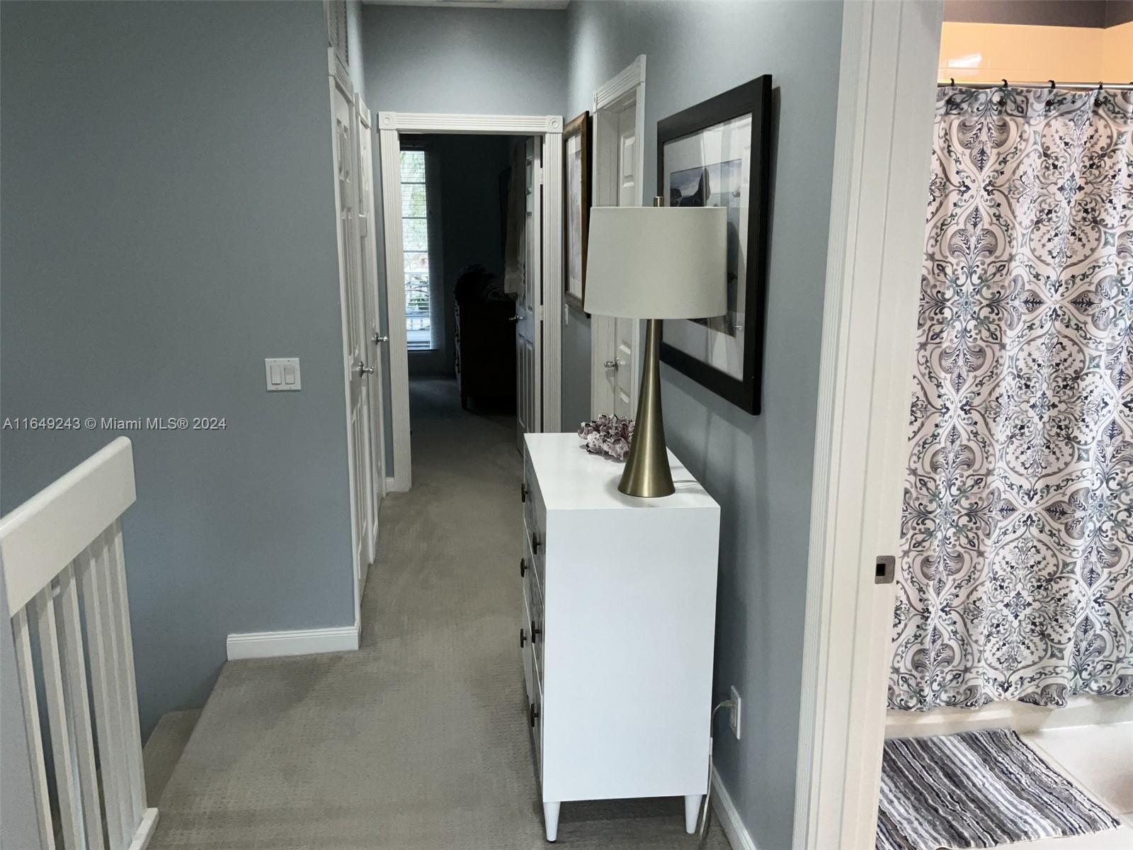 155 Soriano Drive, Unit 155 Jupiter, FL 33458 - Photo 15 of 29 a en suite bathroom with a sink and mirror