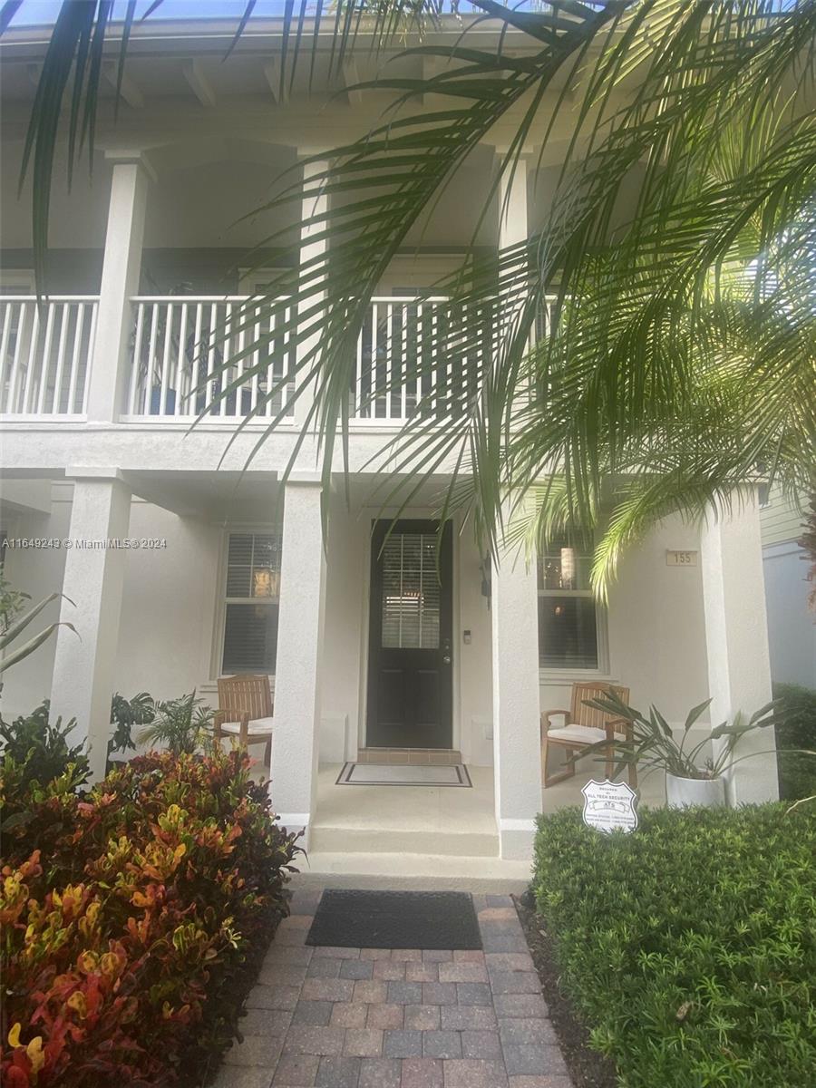 155 Soriano Drive, Unit 155 Jupiter, FL 33458 - Photo 19 of 29 a front view of a house
