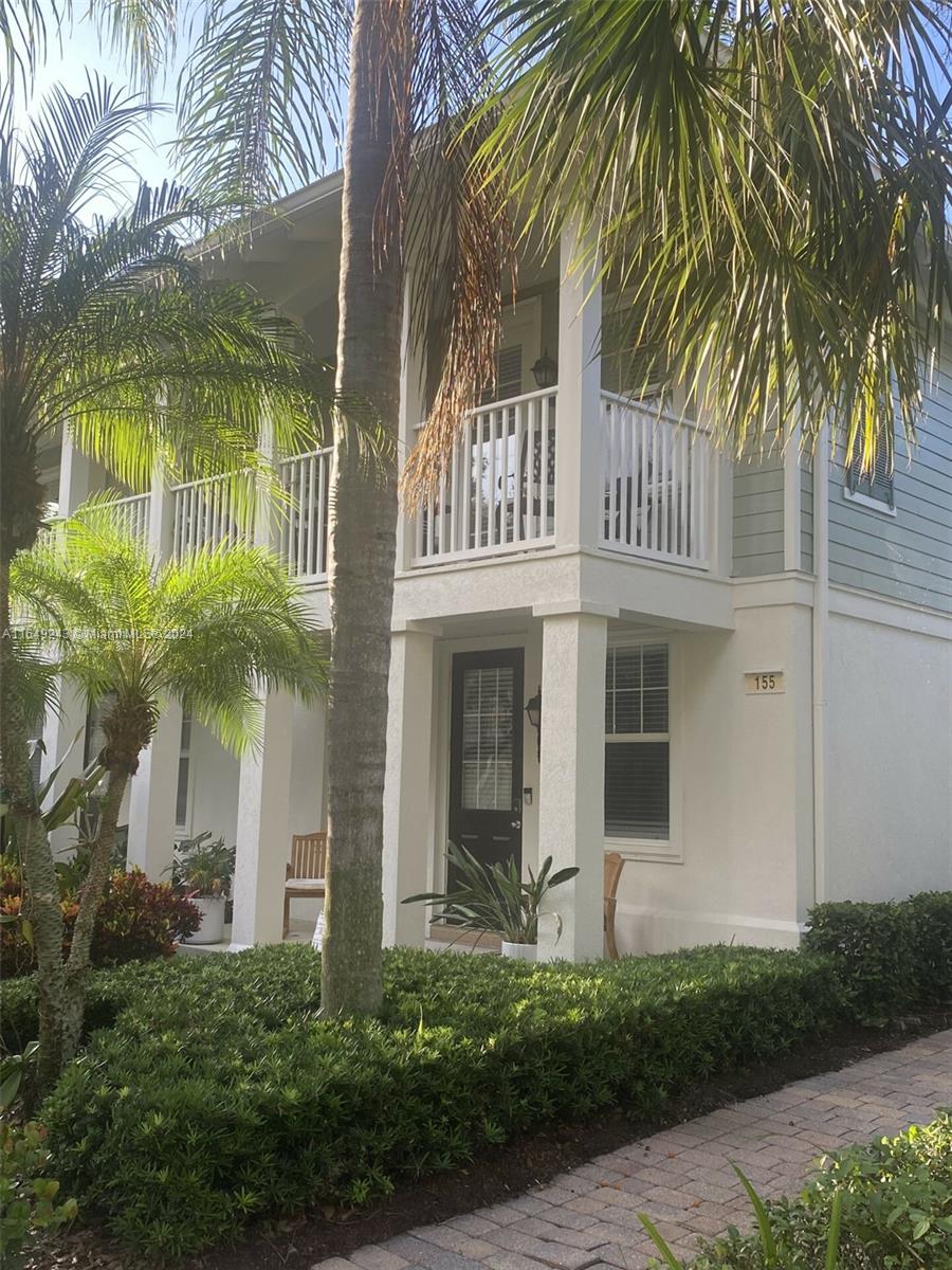 155 Soriano Drive, Unit 155 Jupiter, FL 33458 - Photo 21 of 29 a front view of a house with balcony