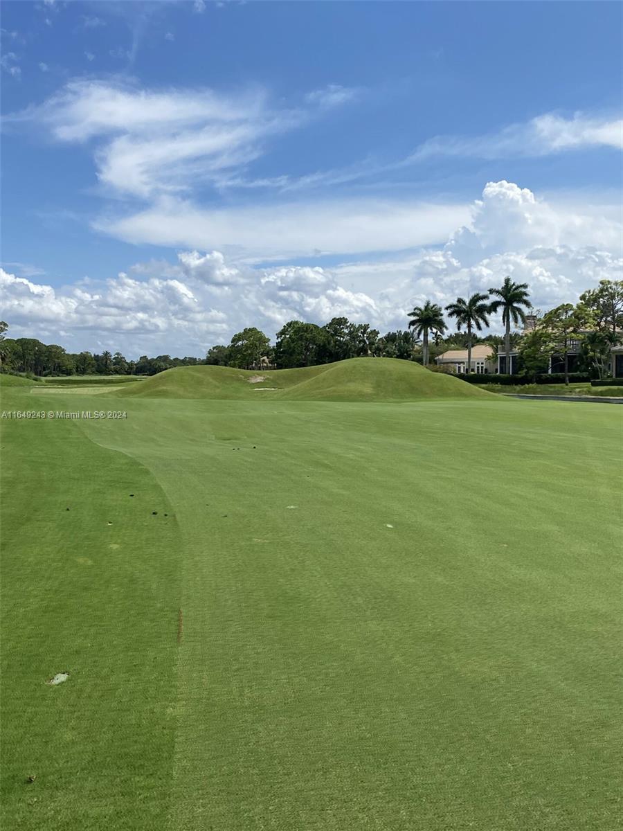 155 Soriano Drive, Unit 155 Jupiter, FL 33458 - Photo 28 of 29 a view of a lake and a mountain