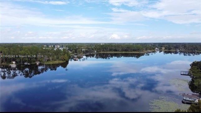 155 Soriano Drive, Unit 155 Jupiter, FL 33458 - Photo 29 of 29 a view of a lake with houses in back