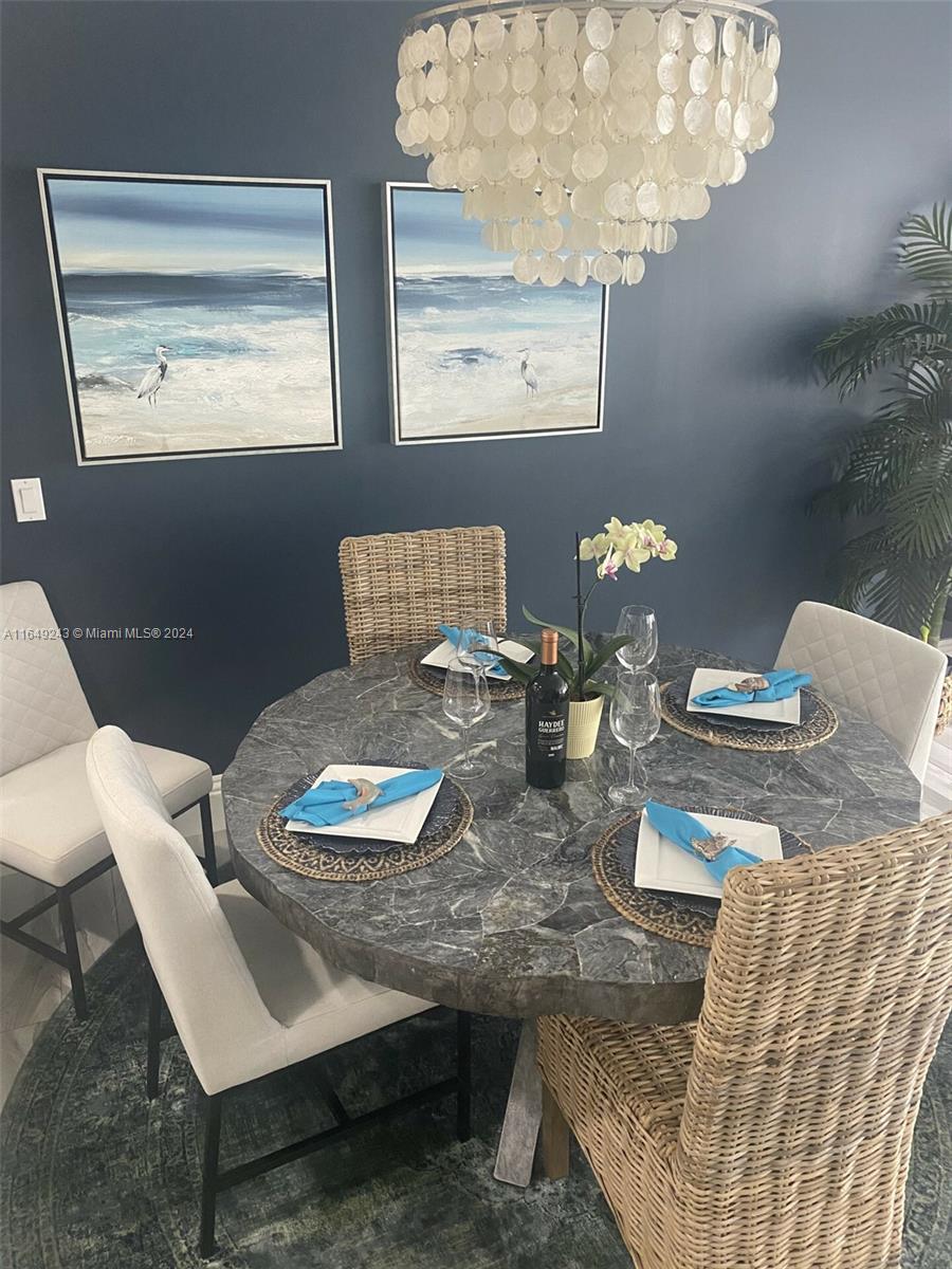 155 Soriano Drive, Unit 155 Jupiter, FL 33458 - Photo 5 of 29 a view of a dining room with furniture