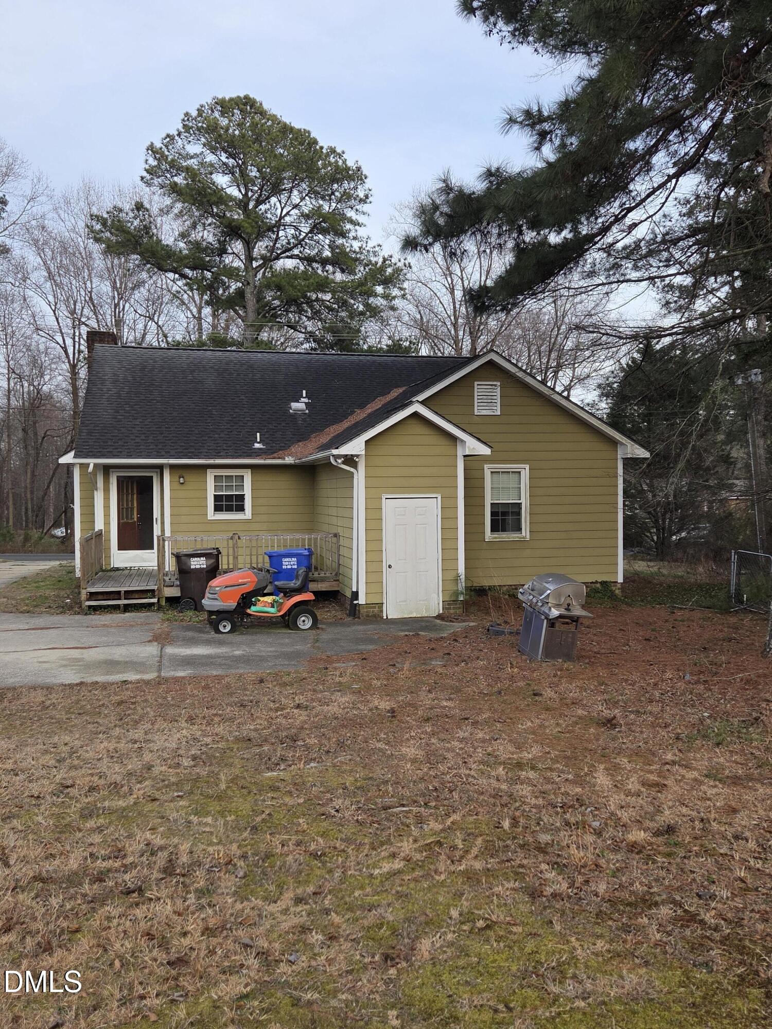 727 North Orange Street Coats, NC 27521 - Photo 2 of 14 a view of a house with backyard
