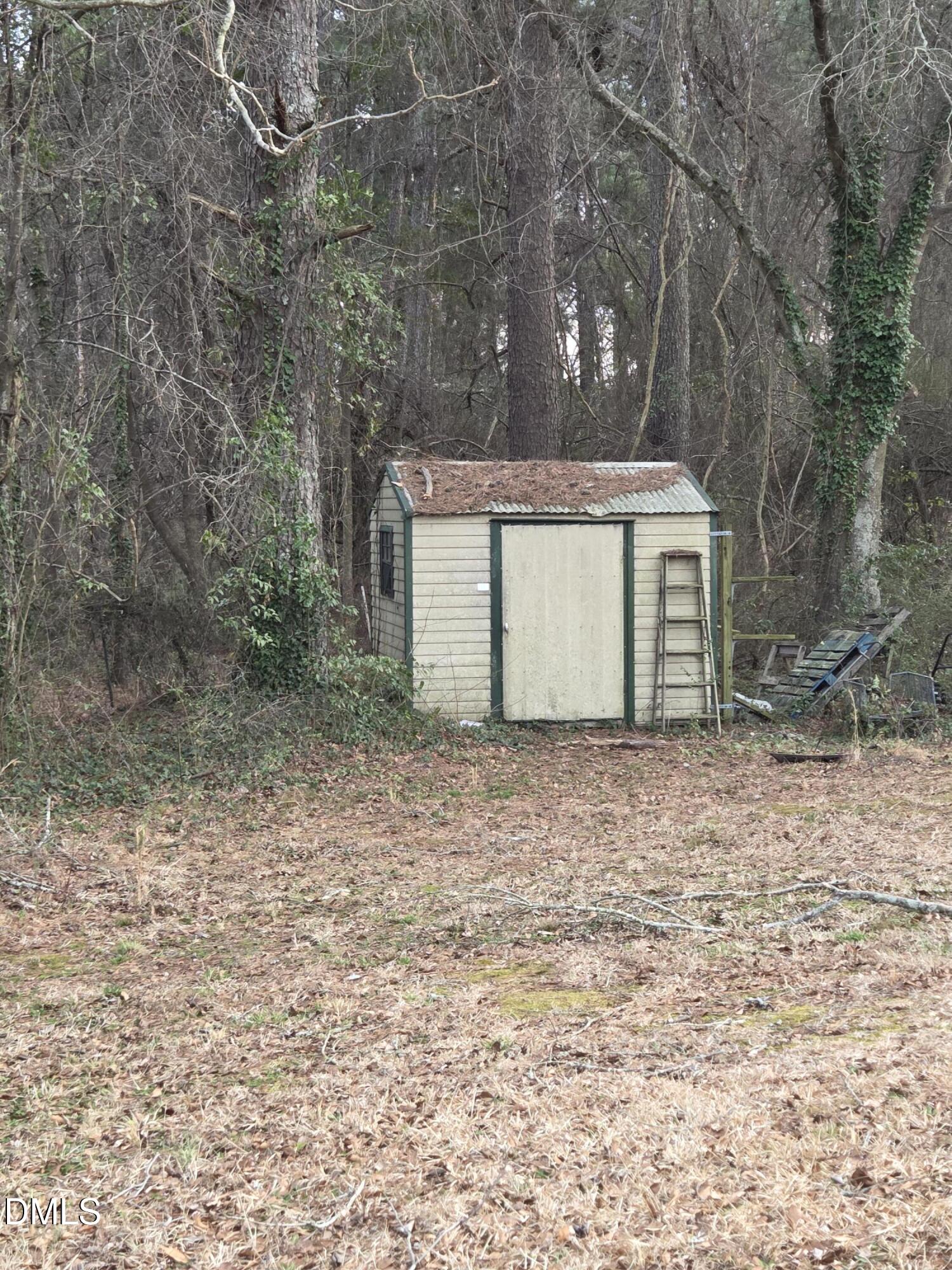 727 North Orange Street Coats, NC 27521 - Photo 3 of 14 a view of a house with a yard