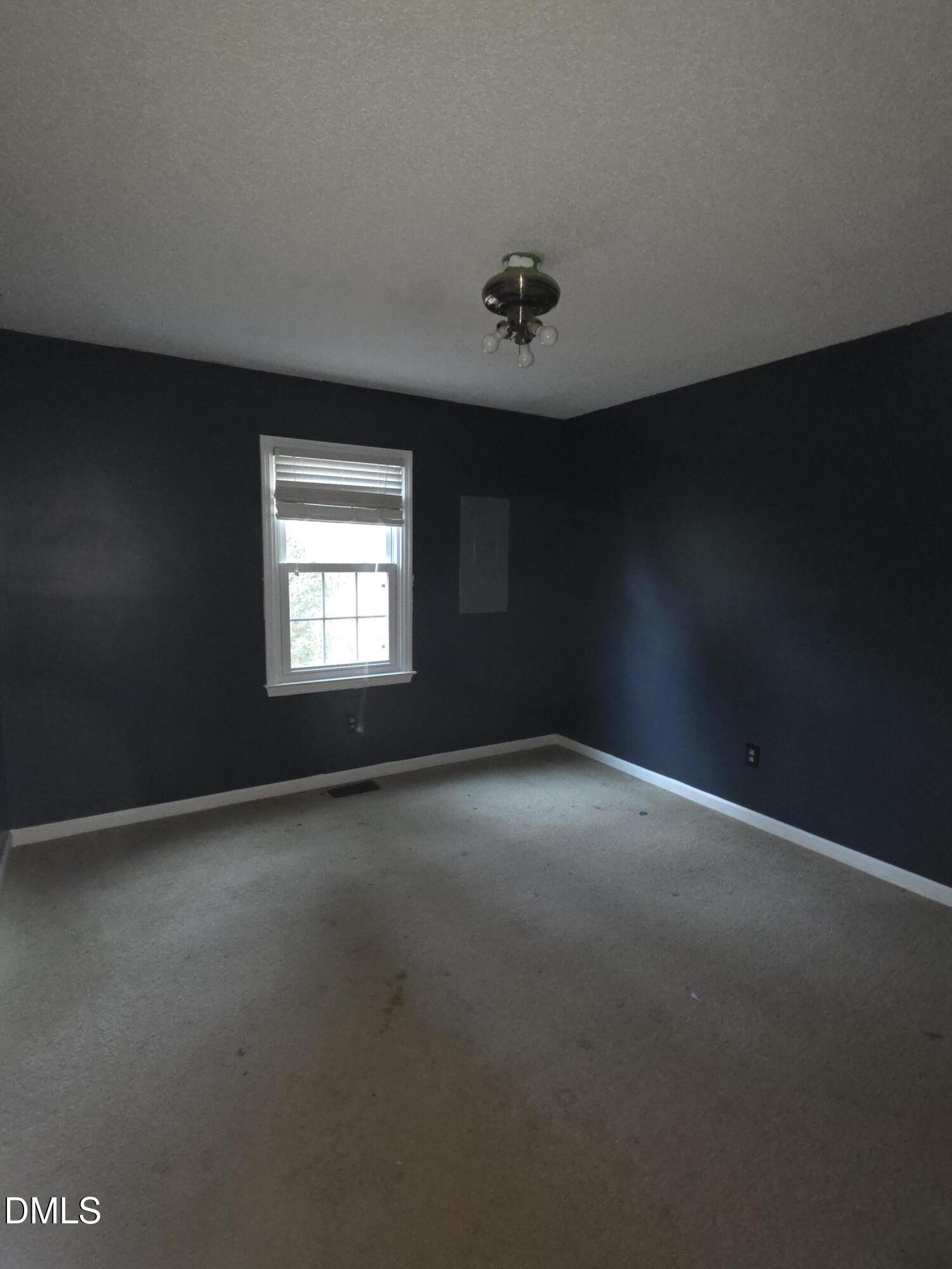 727 North Orange Street Coats, NC 27521 - Photo 6 of 14 a view of empty room with windows