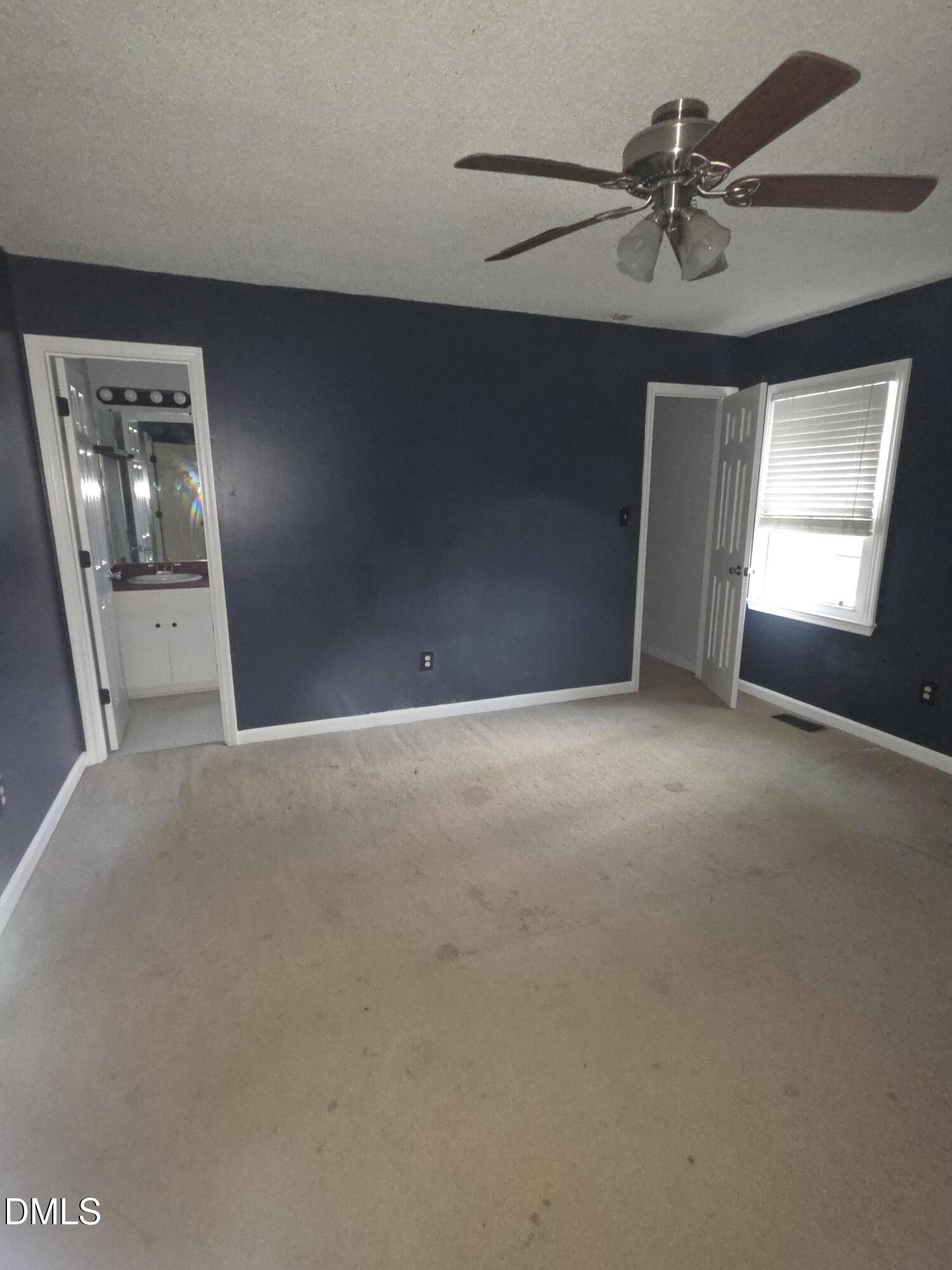727 North Orange Street Coats, NC 27521 - Photo 7 of 14 a view of an empty room with a window