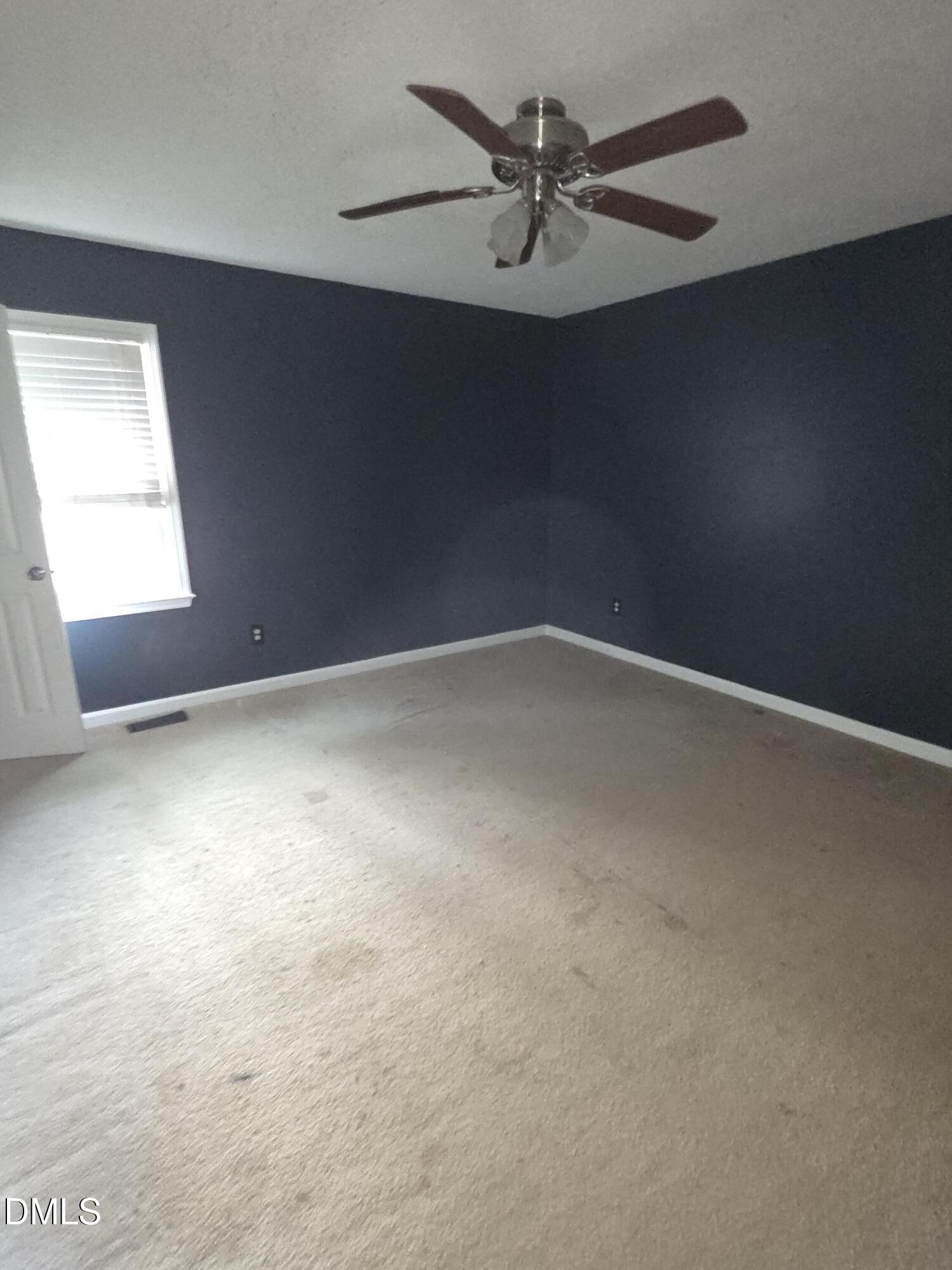727 North Orange Street Coats, NC 27521 - Photo 9 of 14 an empty room with a window