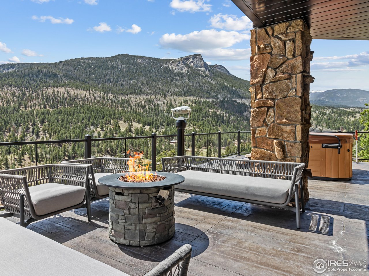 2701 Fall River Road Estes Park, CO 80517 - Photo 1 of 40 a view of a terrace with couches and a potted plant on a table