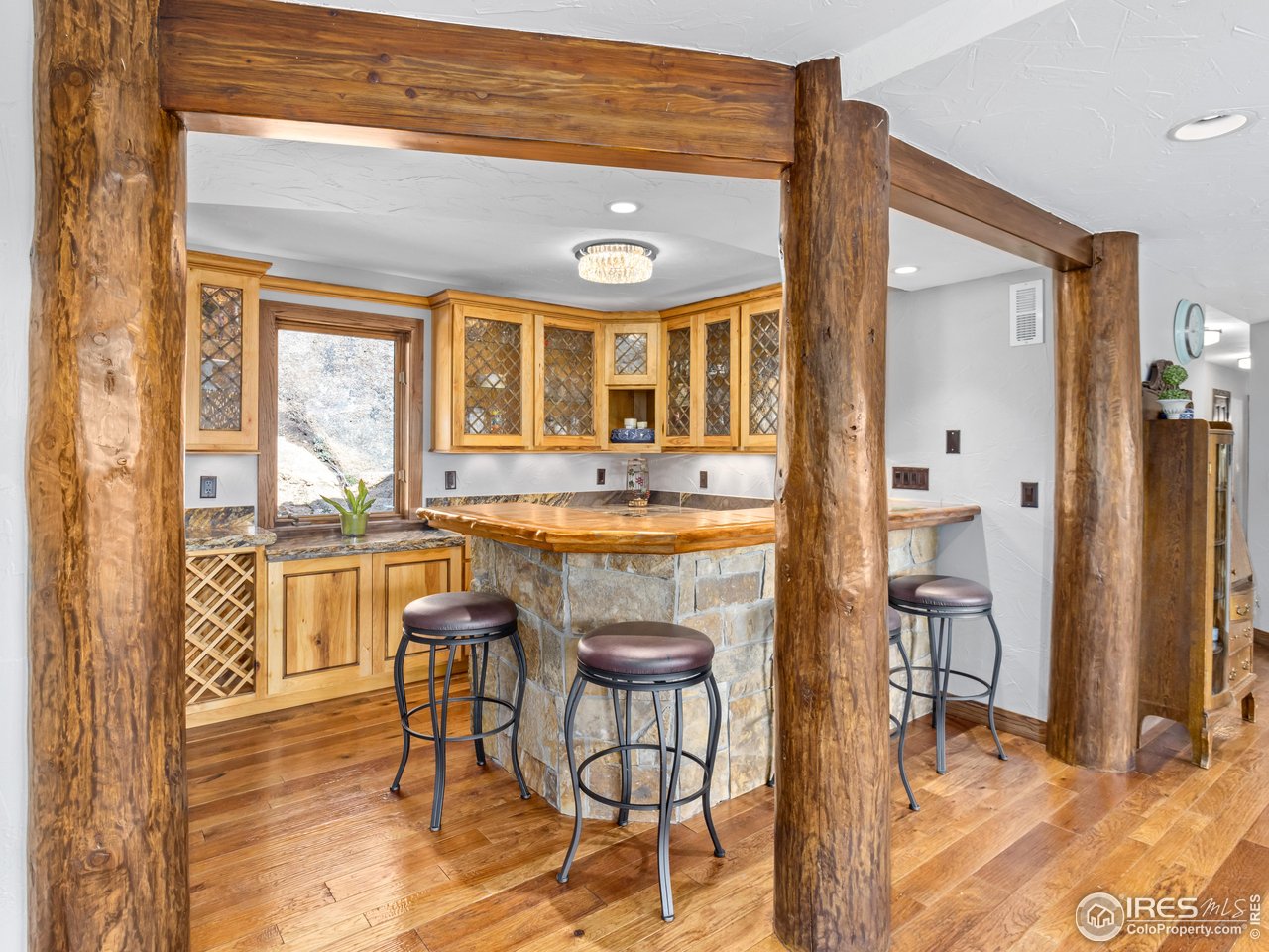 2701 Fall River Road Estes Park, CO 80517 - Photo 25 of 40 a view of a dining room with furniture and wooden floor