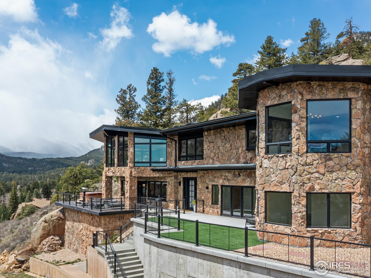 2701 Fall River Road Estes Park, CO 80517 - Photo 3 of 40 a view of a house with a porch