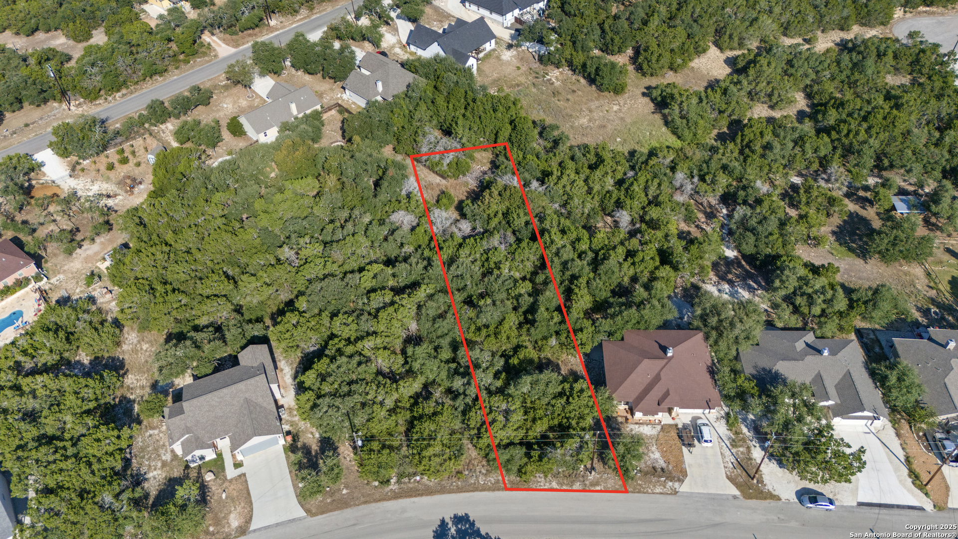 1483 Redwood Road Fischer, TX 78623 - Photo 11 of 13 an aerial view of a house with a yard