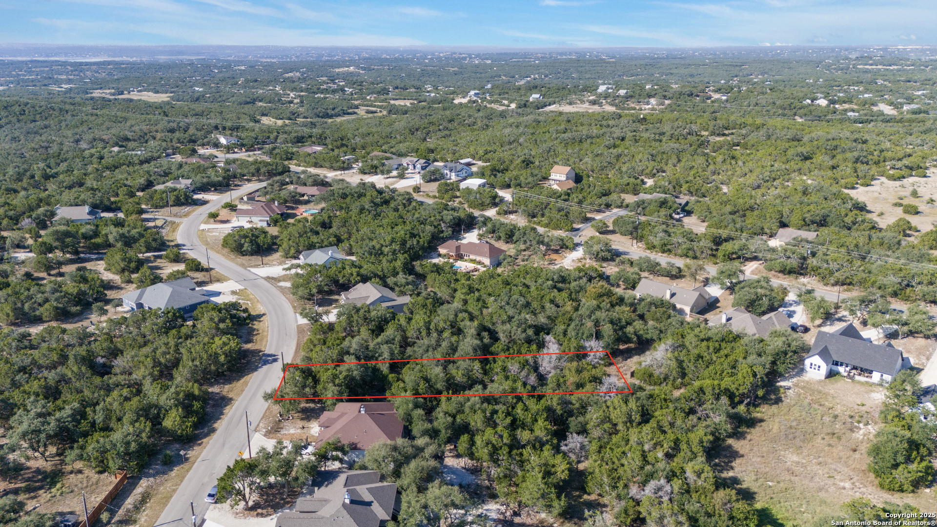 1483 Redwood Road Fischer, TX 78623 - Photo 3 of 13 an aerial view of residential houses with outdoor space and trees