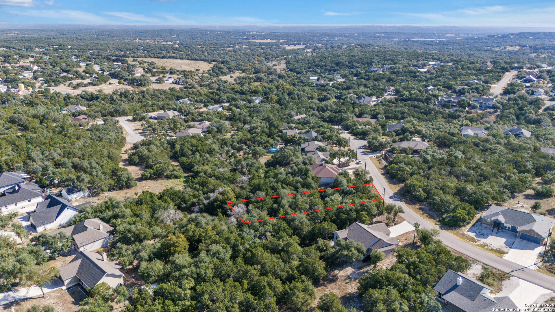 1483 Redwood Road Fischer, TX 78623 - Photo 7 of 13 an aerial view of a city