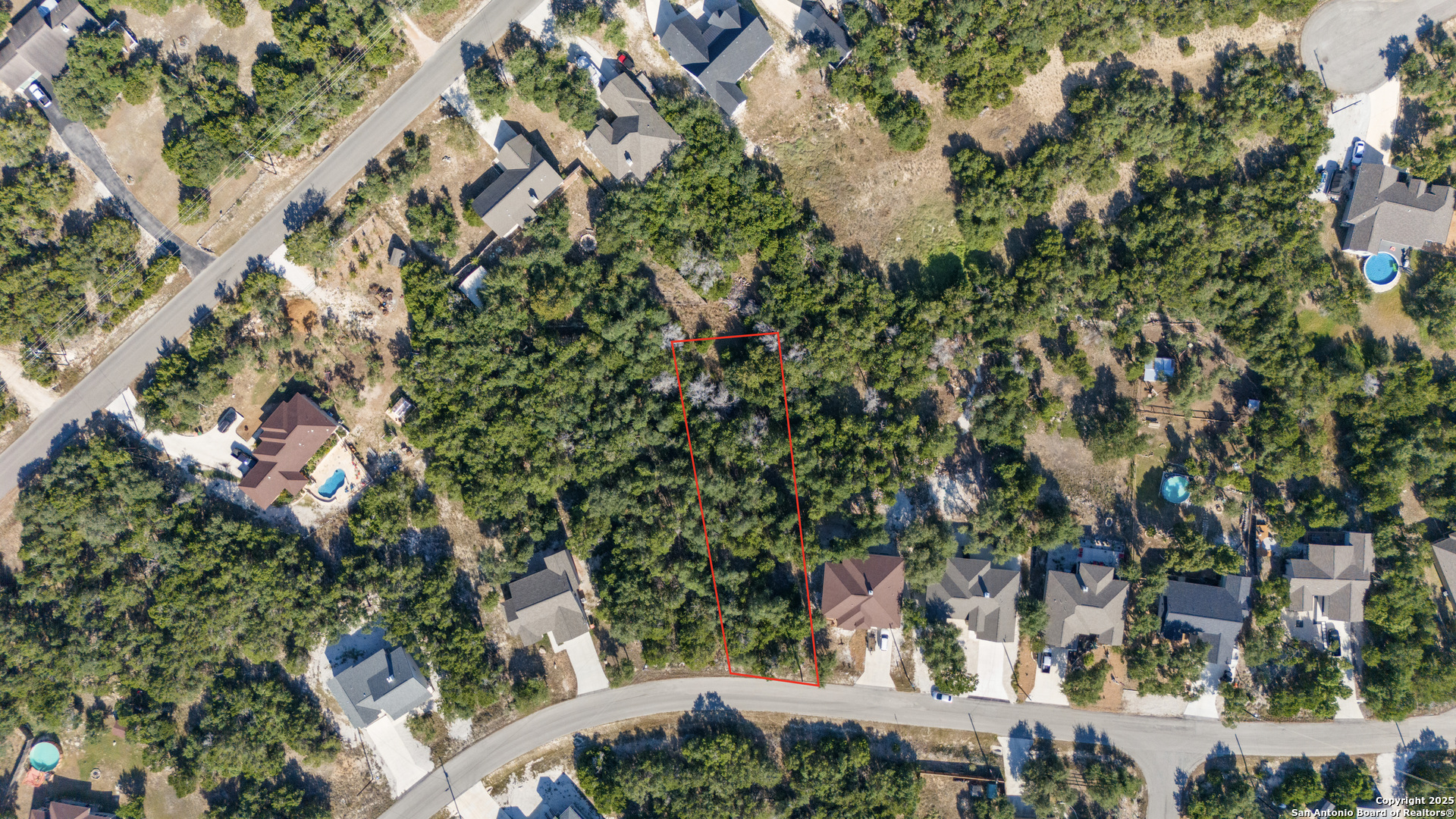 1483 Redwood Road Fischer, TX 78623 - Photo 10 of 13 an aerial view of residential houses with outdoor space and trees