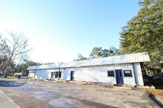 a front view of a house with a road