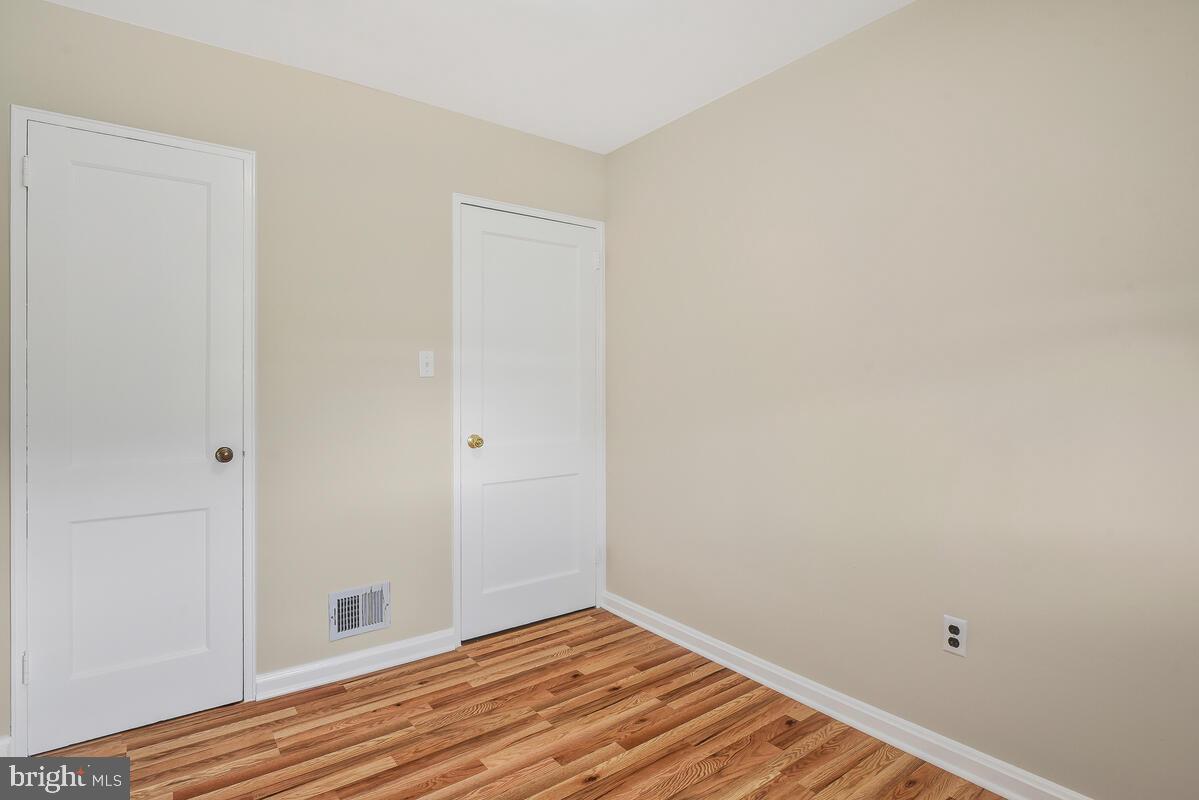 4982 Sargent Road Northeast Washington, DC 20017 - Photo 23 of 35 a view of room with wooden floor