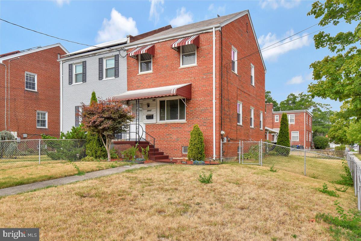 4982 Sargent Road Northeast Washington, DC 20017 - Photo 3 of 35 a view of a house with a yard