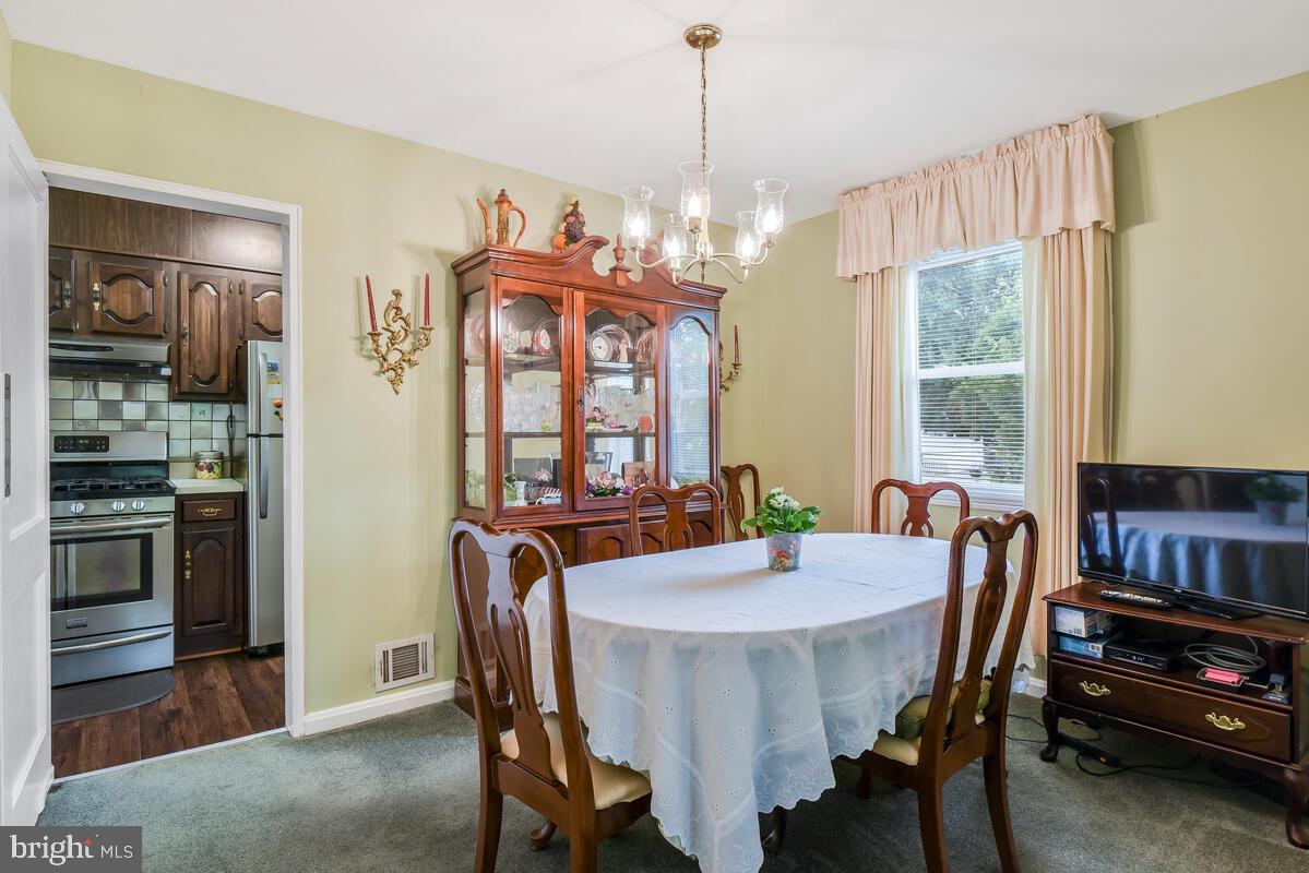 4982 Sargent Road Northeast Washington, DC 20017 - Photo 10 of 35 a view of a dining room with furniture window and outside view