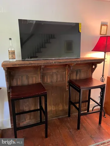 a view of house with wooden floor and furniture