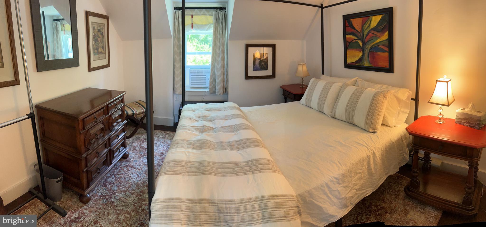 6230 Lower York Road New Hope, PA 18938 - Photo 10 of 20 a bedroom with a bed and wooden floor