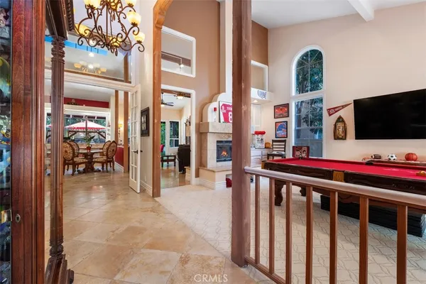 a view of a living room with a tv and furniture