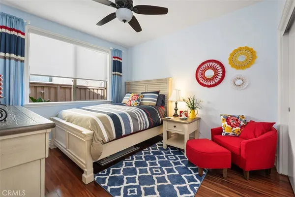 a bedroom with bed and a window