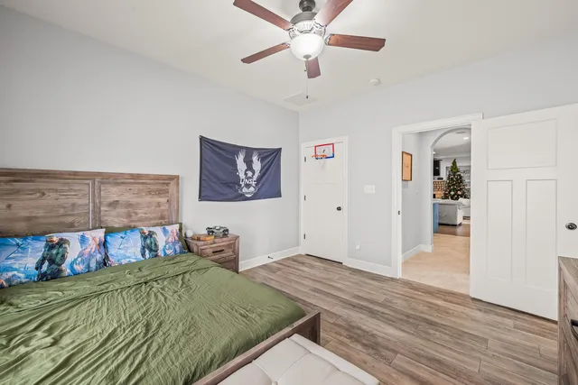a bedroom with a bed and dresser