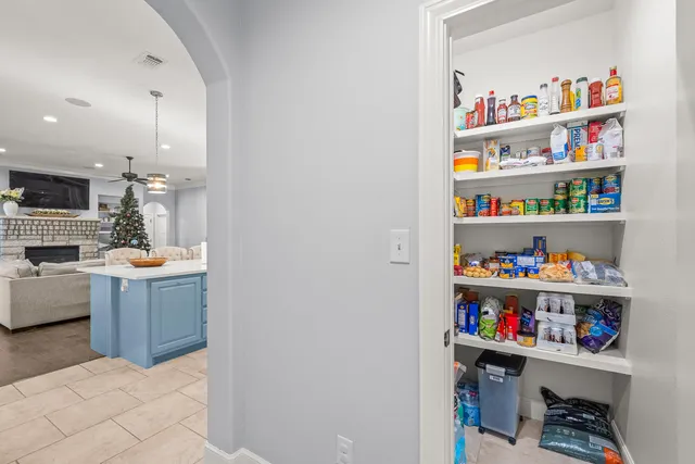 a open kitchen with cabinets a sink and a wooden floor
