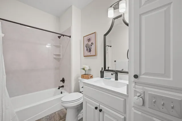 a bathroom with a sink a toilet and a bathtub