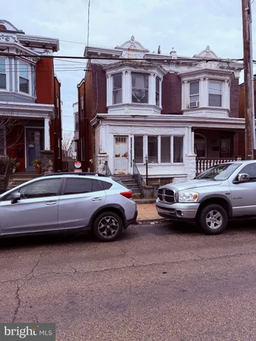 a car parked in front of a house