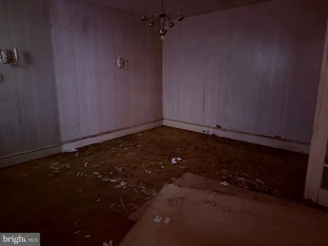 an empty room with a wooden floor