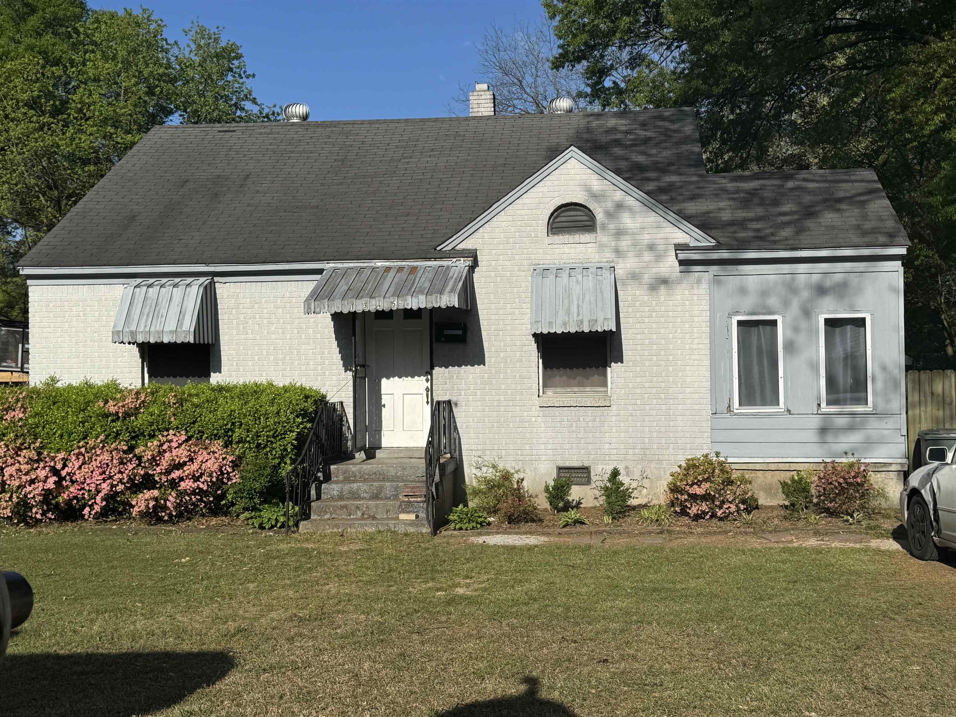 1345 Maria Street Memphis, TN 38122 - Photo 1 of 11 a front view of a house with a yard