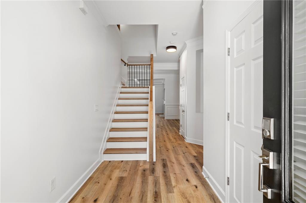 3628 Ashcroft Bend Atlanta, GA 30319 - Photo 4 of 44 a view of a hallway with wooden floor and entryway
