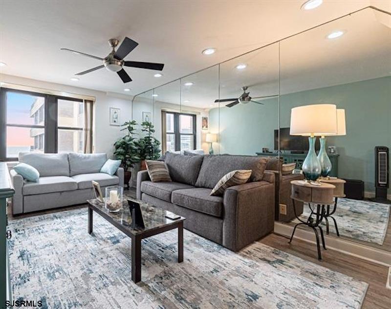 101 South Raleigh Avenue, Unit 625 Atlantic City, NJ 08401 - Photo 5 of 15 a living room with furniture a ceiling fan a window and a flat screen tv