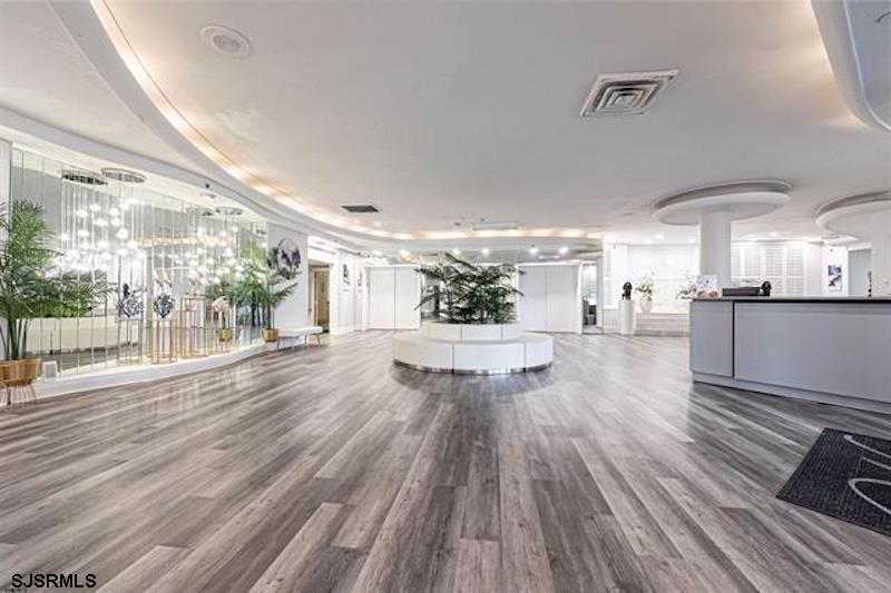 101 South Raleigh Avenue, Unit 625 Atlantic City, NJ 08401 - Photo 10 of 15 a view of a living room hardwood floor and a kitchen