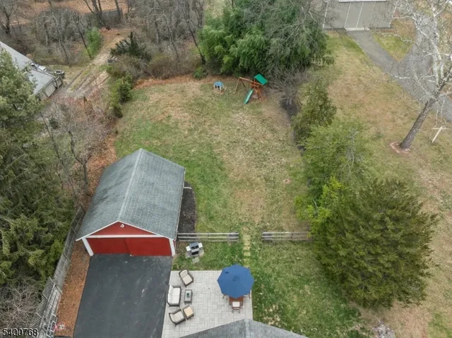 a view of a patio with table and chairs with barbeque grill and couches