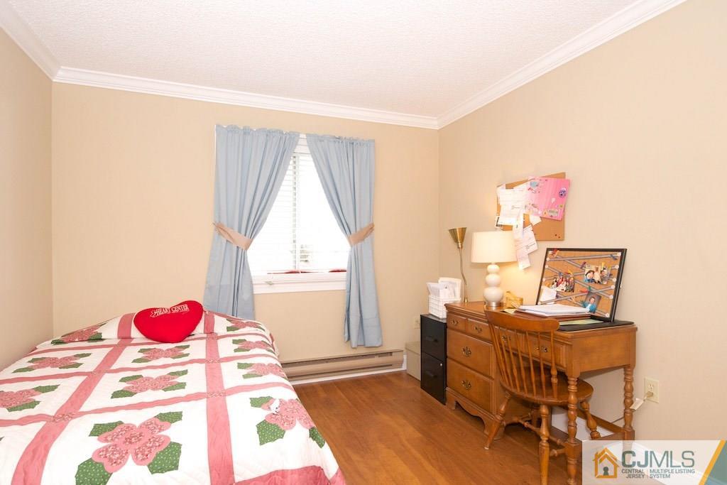 781 B Risley Road Monroe Township, NJ 08831 - Photo 13 of 20 a bedroom with a bed and a window