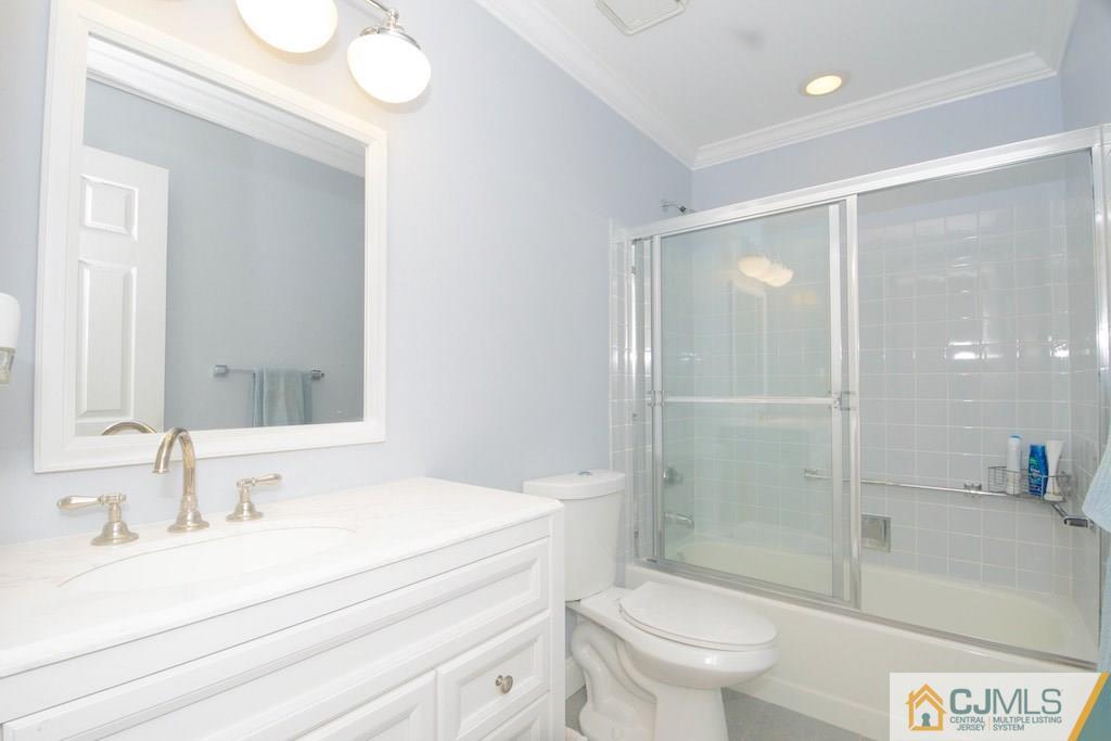 781 B Risley Road Monroe Township, NJ 08831 - Photo 17 of 20 a bathroom with a sink a toilet and shower