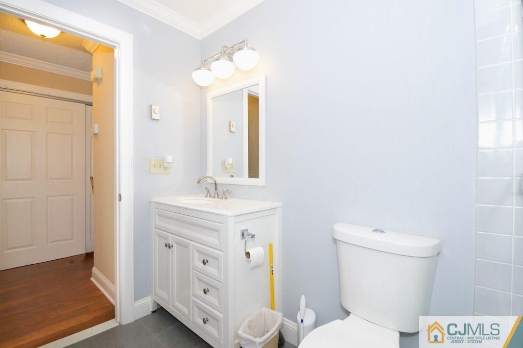 781 B Risley Road Monroe Township, NJ 08831 - Photo 18 of 20 a bathroom with a toilet sink and mirror