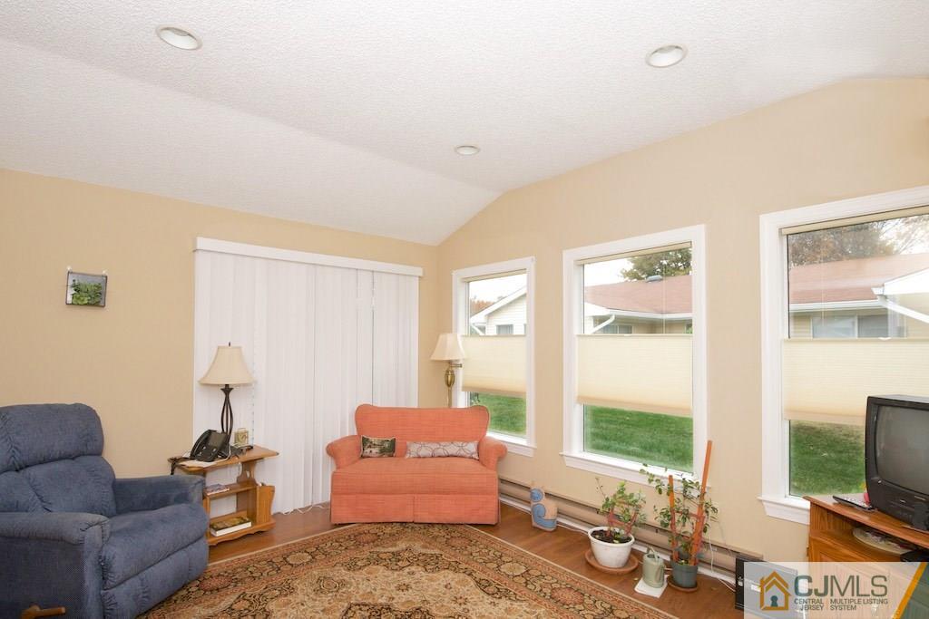 781 B Risley Road Monroe Township, NJ 08831 - Photo 10 of 20 a living room with furniture and a flat screen tv