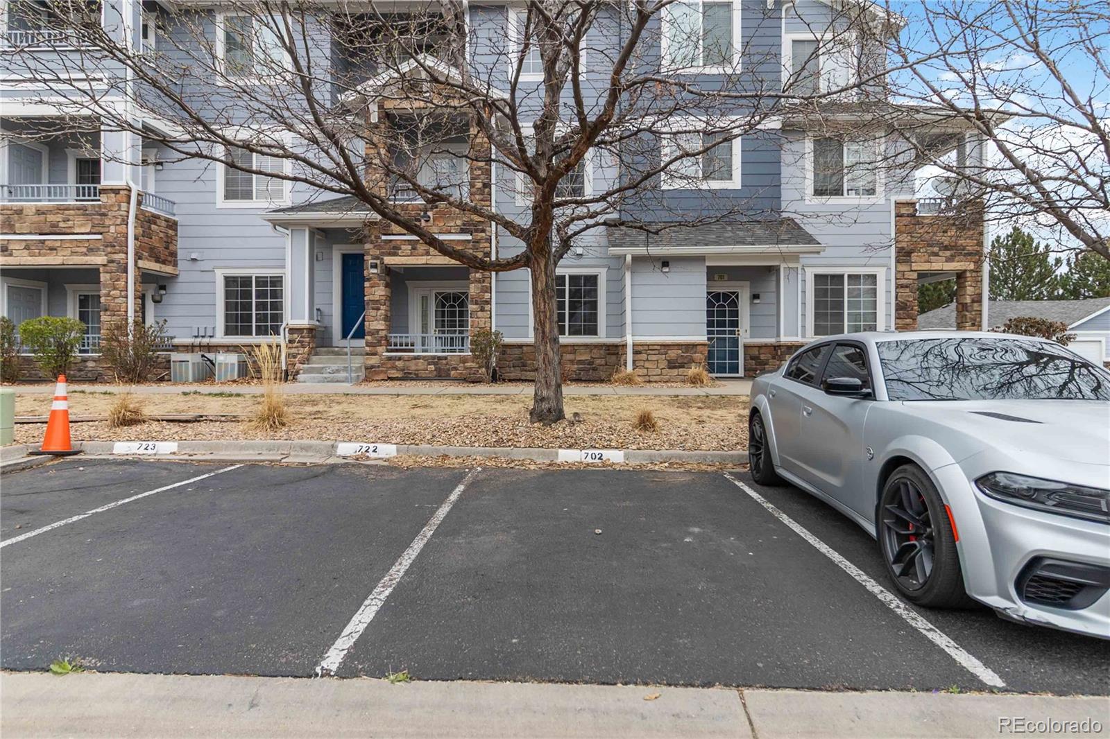 5255 Memphis Street, Unit 702 Denver, CO 80239 - Photo 30 of 30 a view of a car parked in front of a building