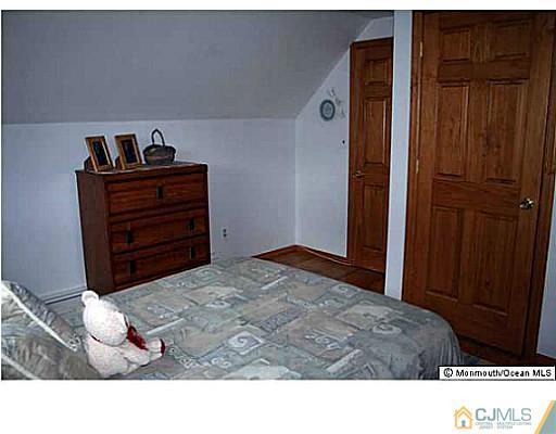 502 Harding Road Old Bridge, NJ 08879 - Photo 10 of 11 a living room with a bed and furniture
